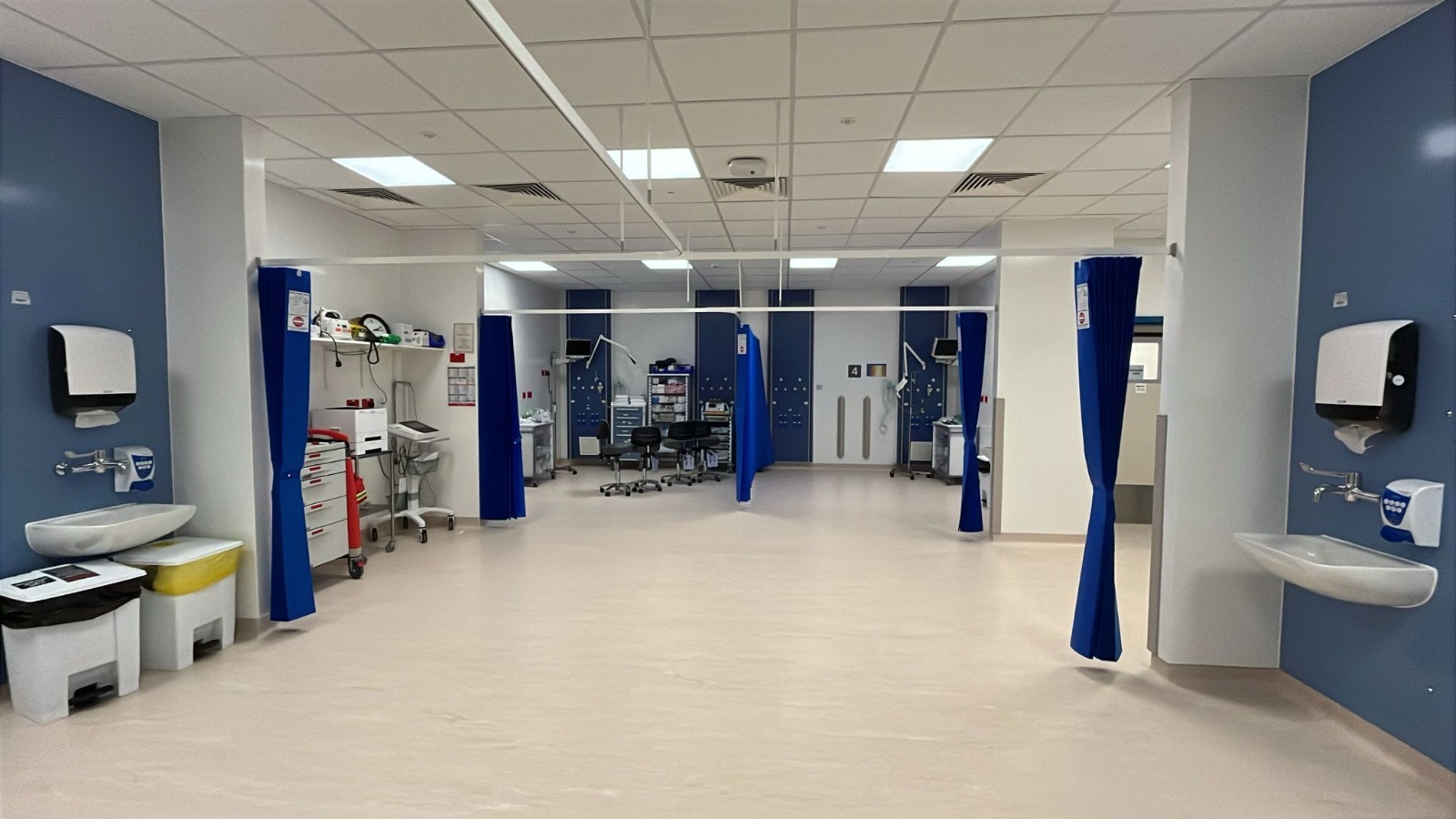 Completed clinical treatment bay with specialist equipment and privacy curtains